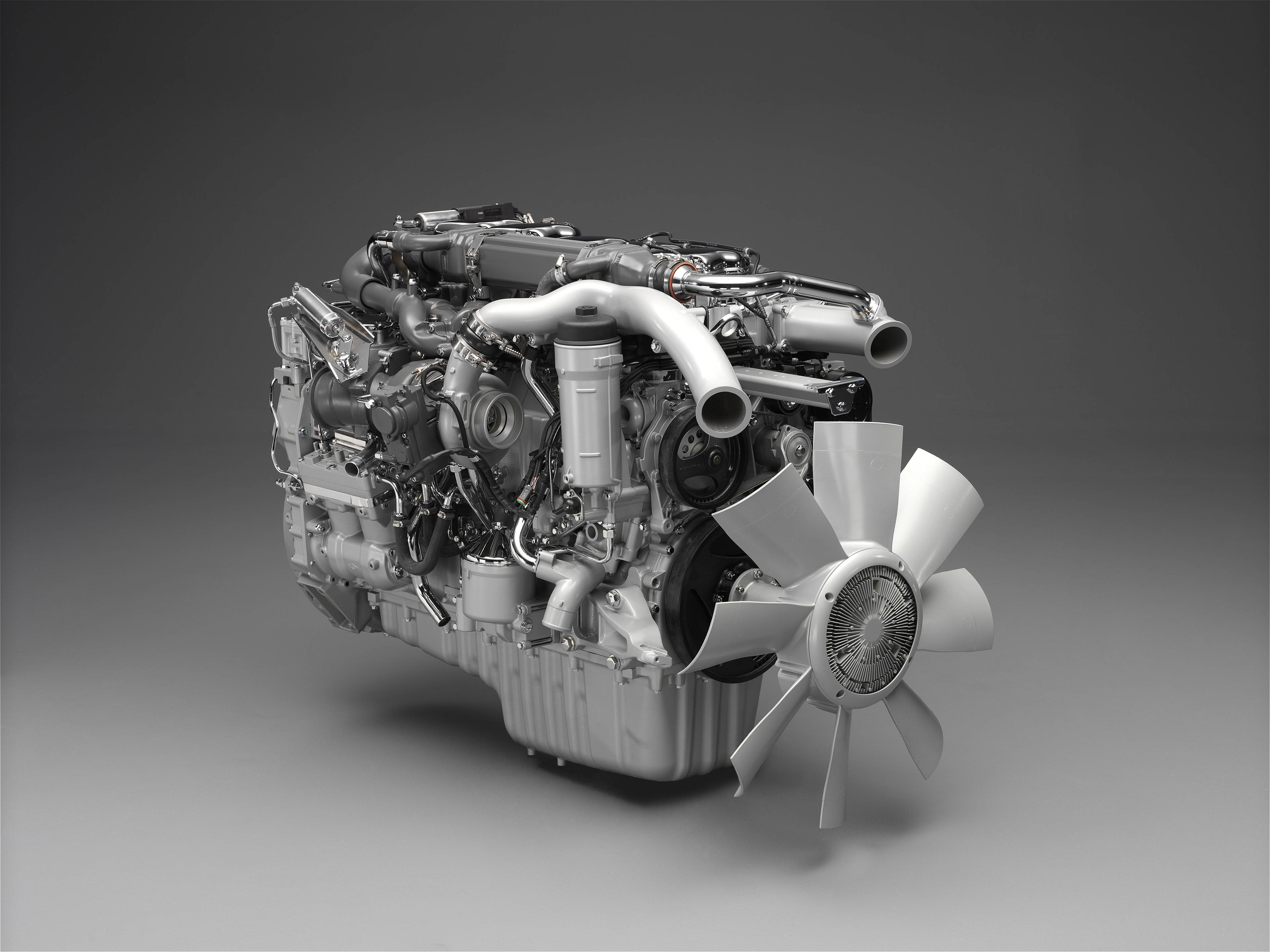 3D mekanisk motor i et slankt gråt design Wallpapers