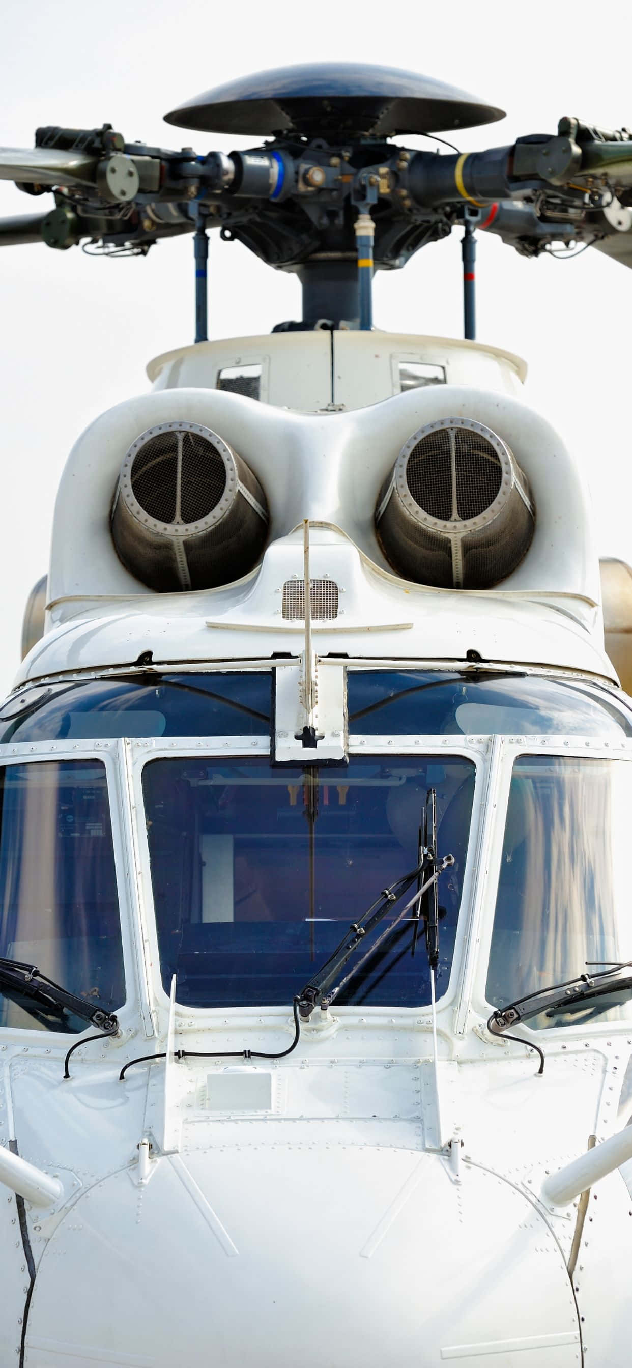 Billede Klart farvede helikoptere mod en iPhone XS Max blå himmelbaggrund Wallpapers