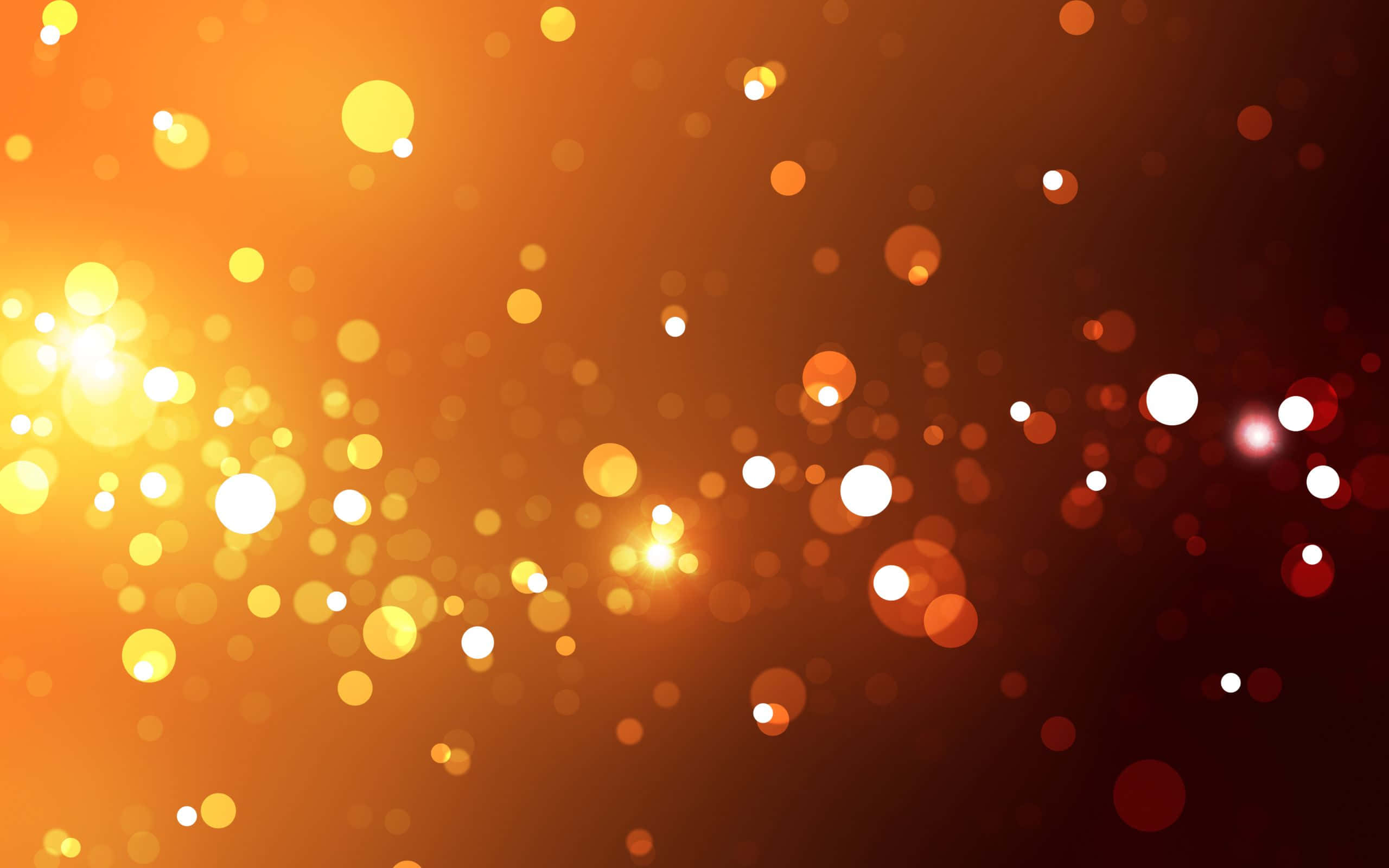 Bokeh-effekter i sort og orange baggrund Wallpapers
