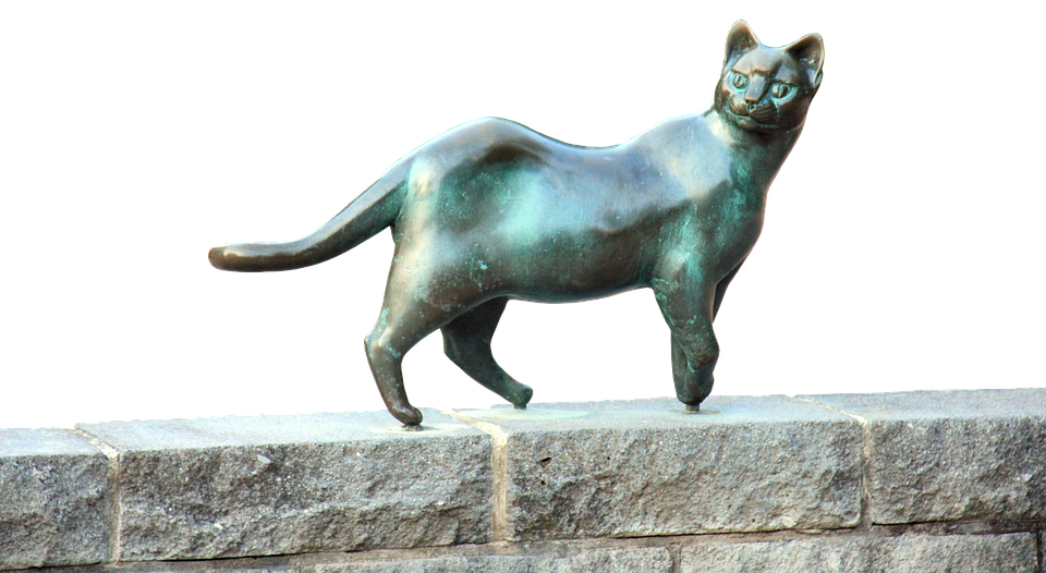 Bronze katteskulptur på stenhylde Wallpapers