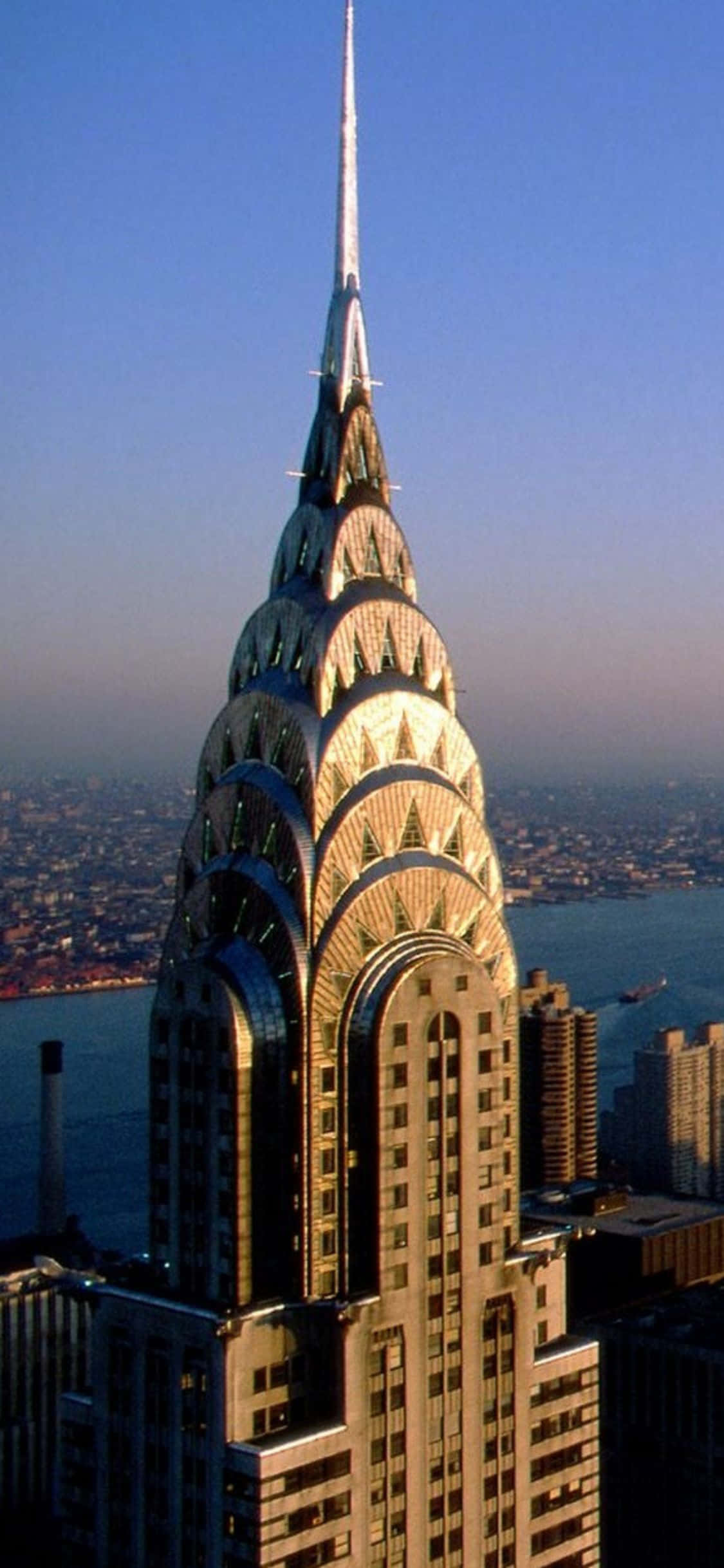 Byen der aldrig sover - New York City om natten, fra den ikoniske skyline til gadelygternes spejlinger i havnen. Wallpapers