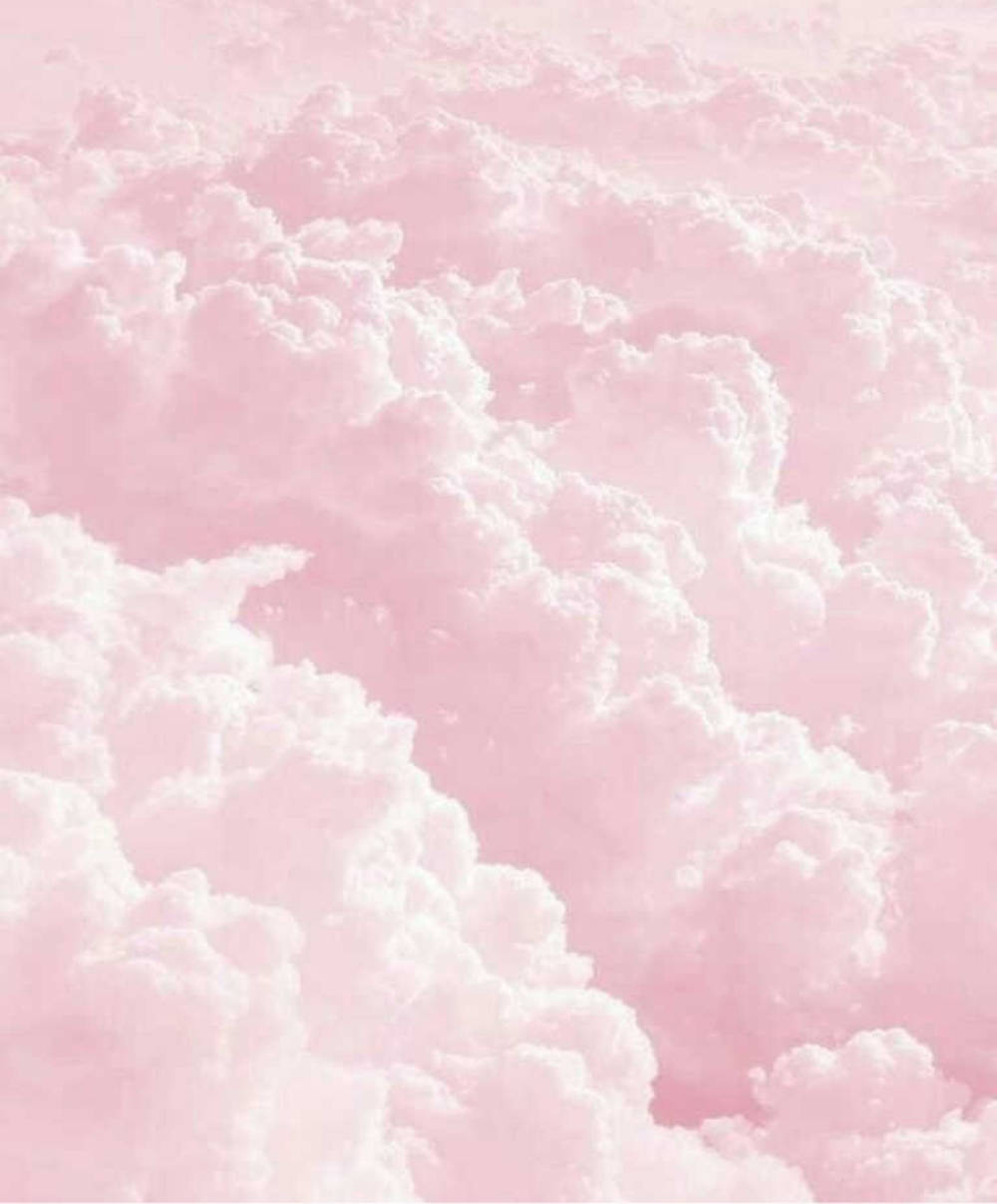 Drømmende pastel iPad-baggrund med tykke lyserøde skyer Wallpapers