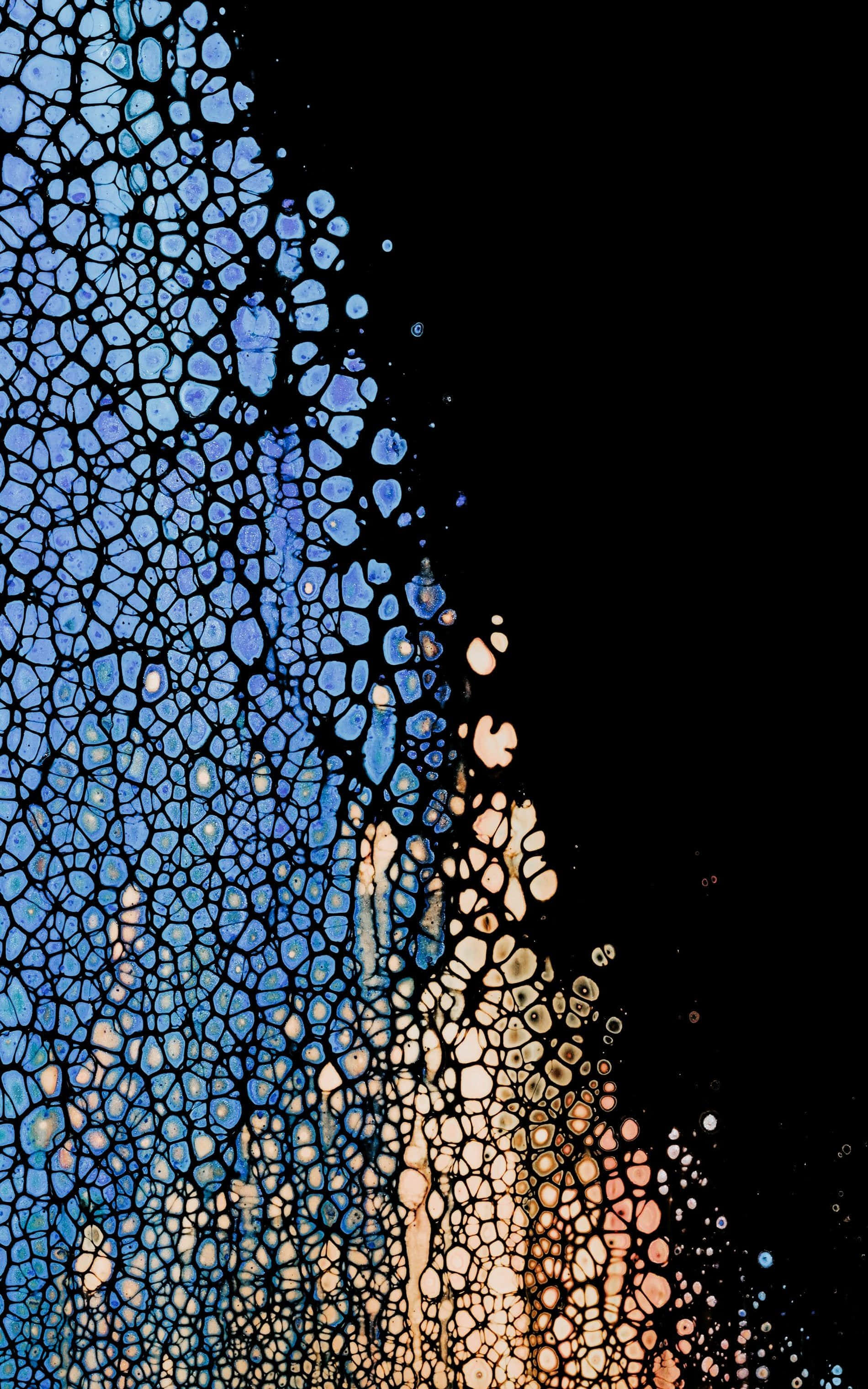 en akvarelbaggrund med et blåt og orange mønster Wallpapers
