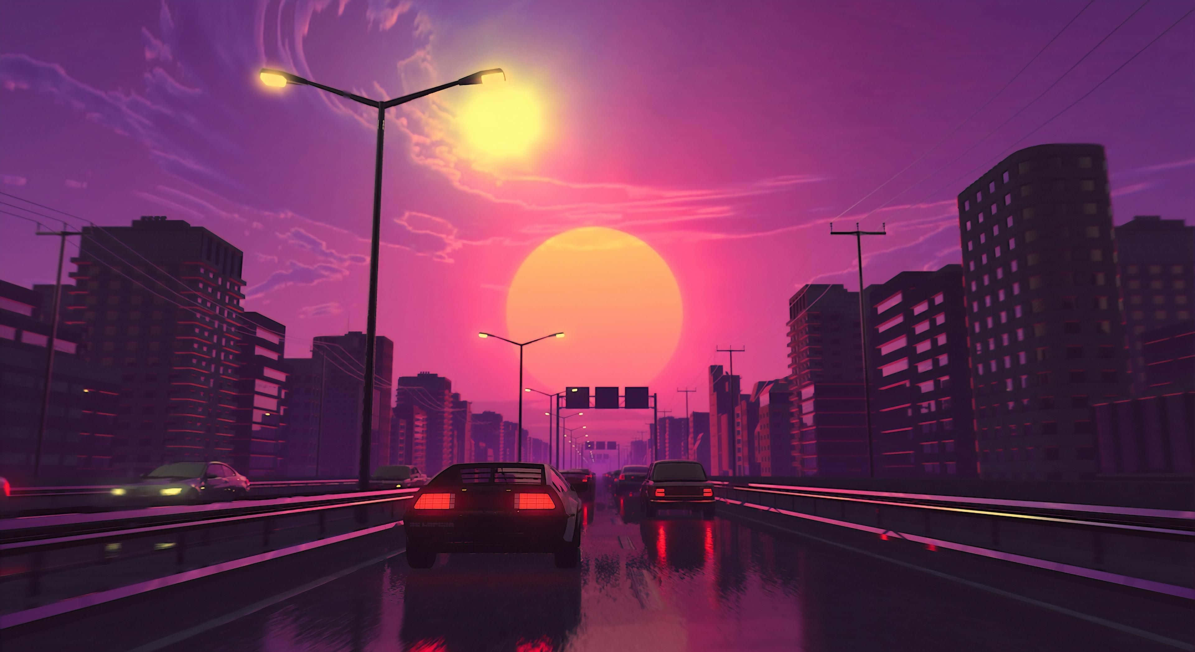 en by om natten med biler der kører ned ad gaden Wallpapers