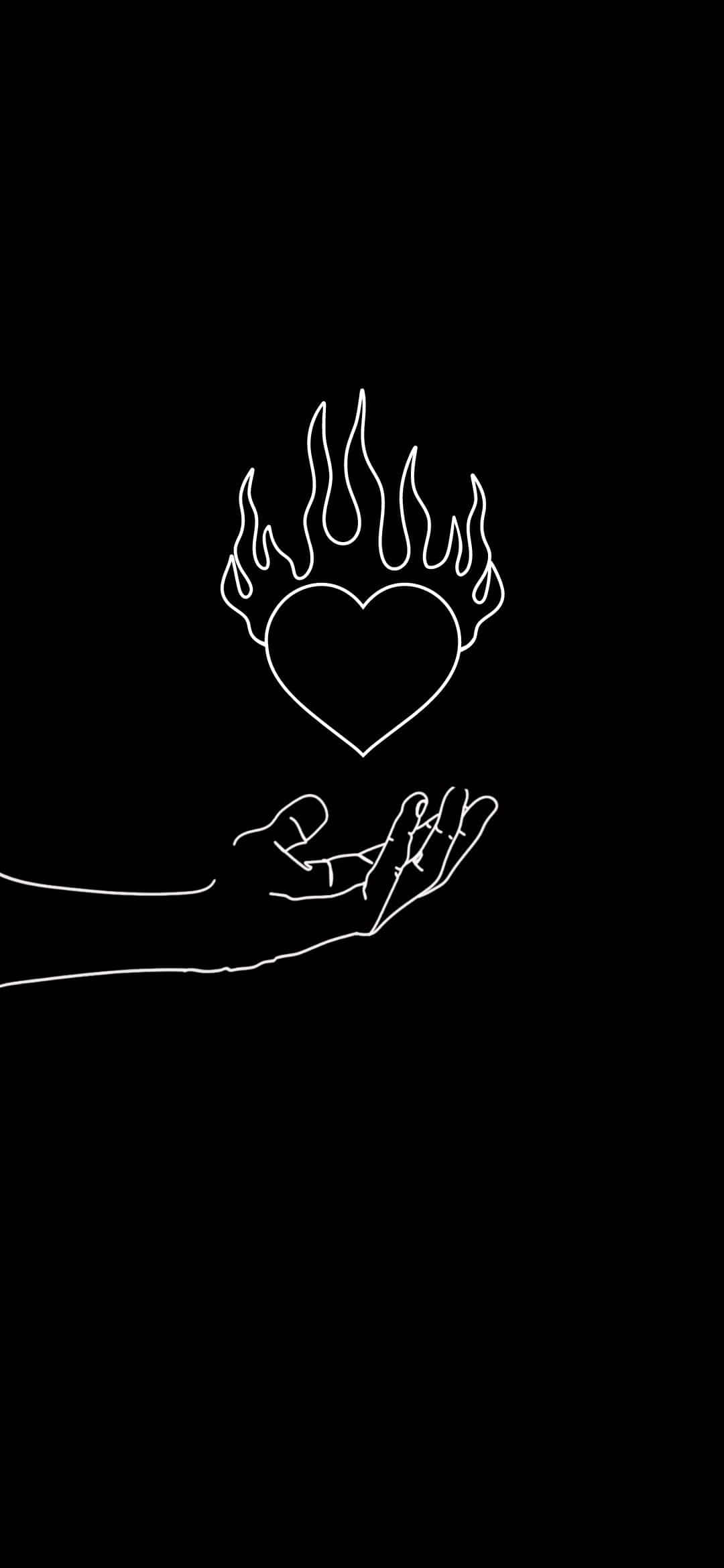 En hånd, der holder et hjerte med flammer på Wallpapers