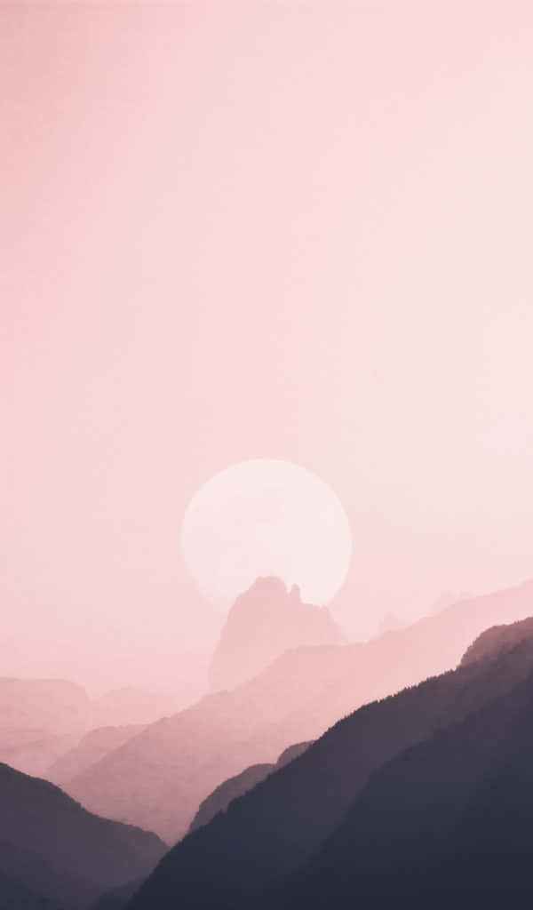 en lyserød solnedgang over bjerge og bakker Wallpapers