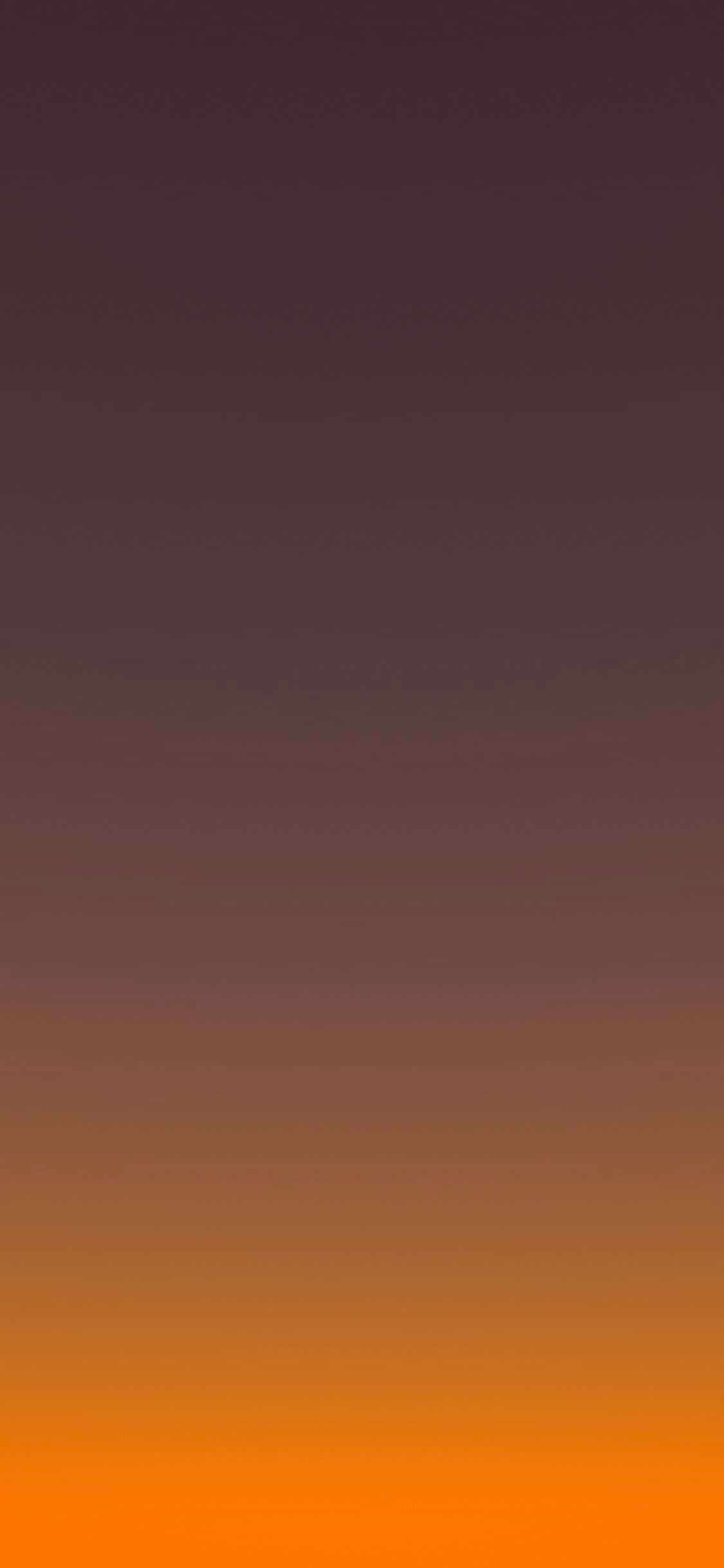 en orange og gul solnedgang med et bjerg i baggrunden Wallpapers