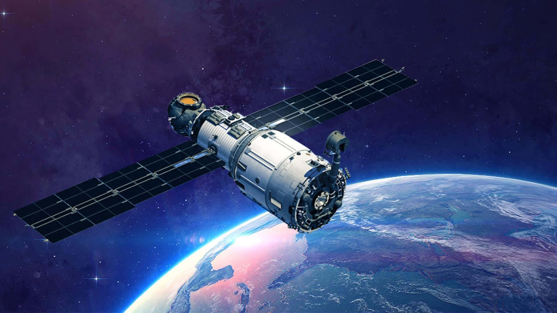En satellit flyver over jorden Wallpapers