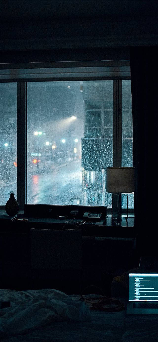 en seng med en bærbar computer på Wallpapers