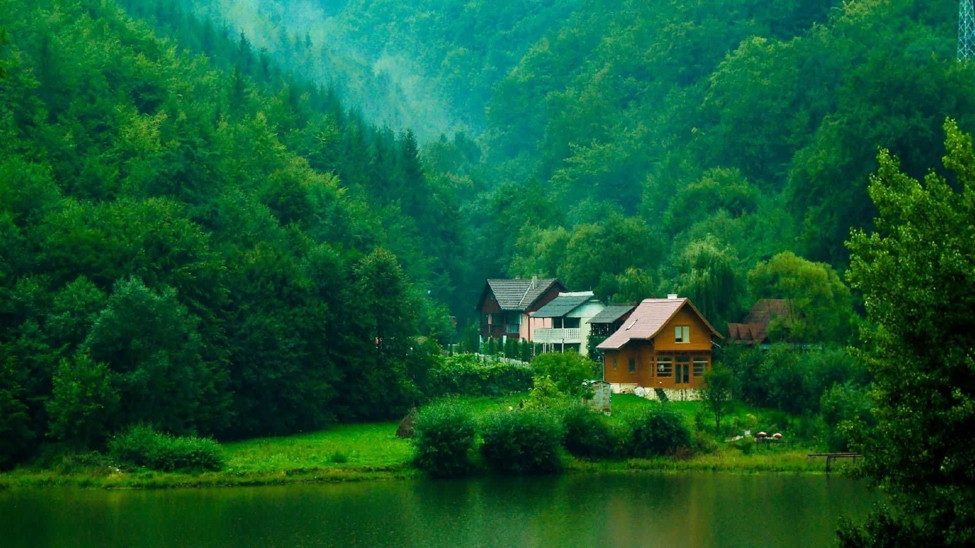 en sø med huse og træer i baggrunden Wallpapers
