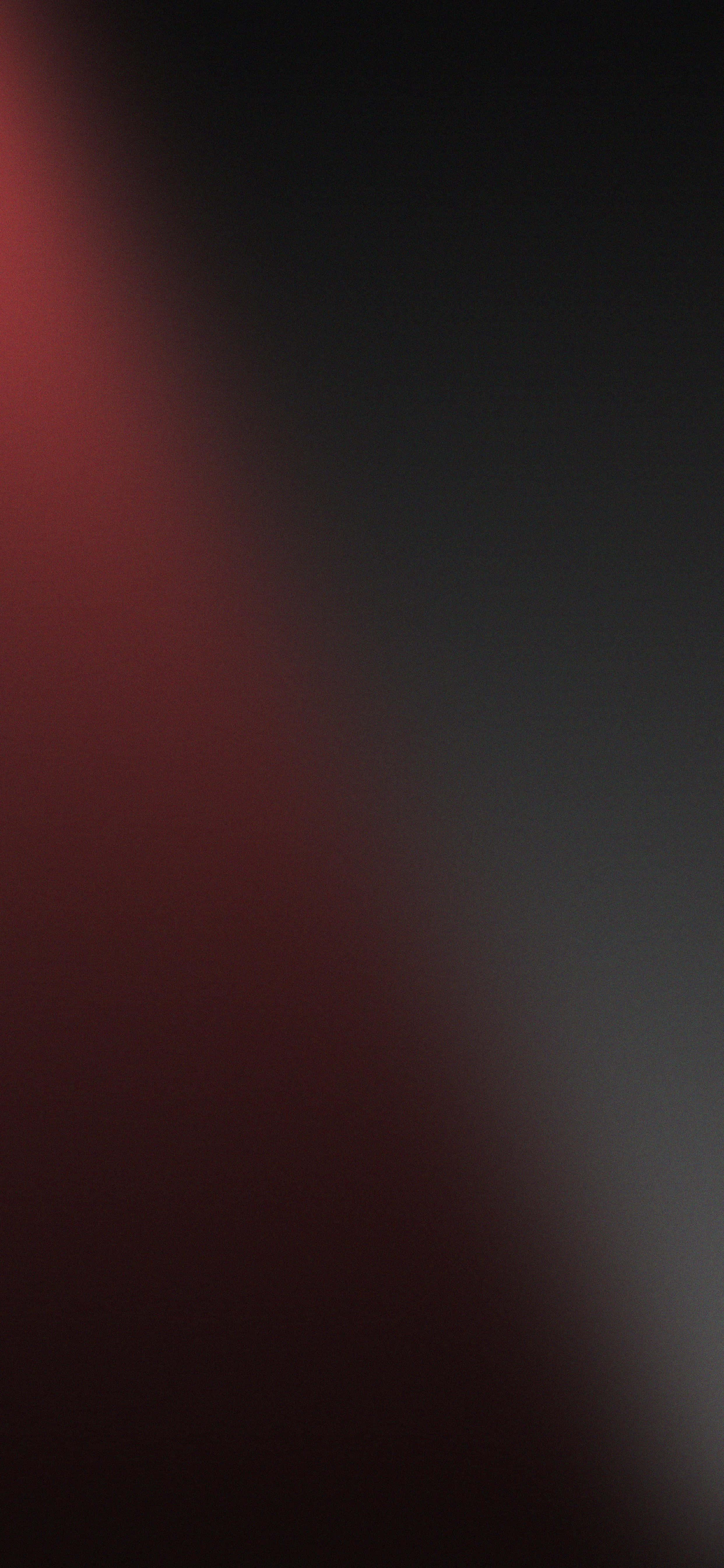 en sort og rød baggrund med et lys, der skinner på den Wallpapers