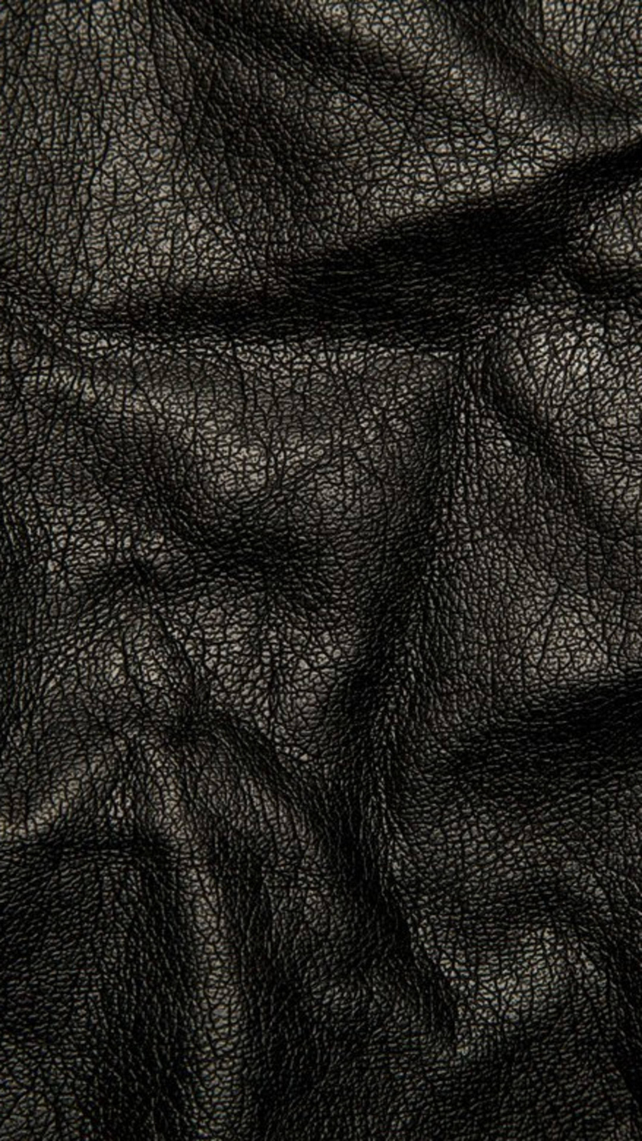 Enigmatisk elegance: Krøllet læder 4K Ultra HD mørk telefonbaggrund Wallpapers