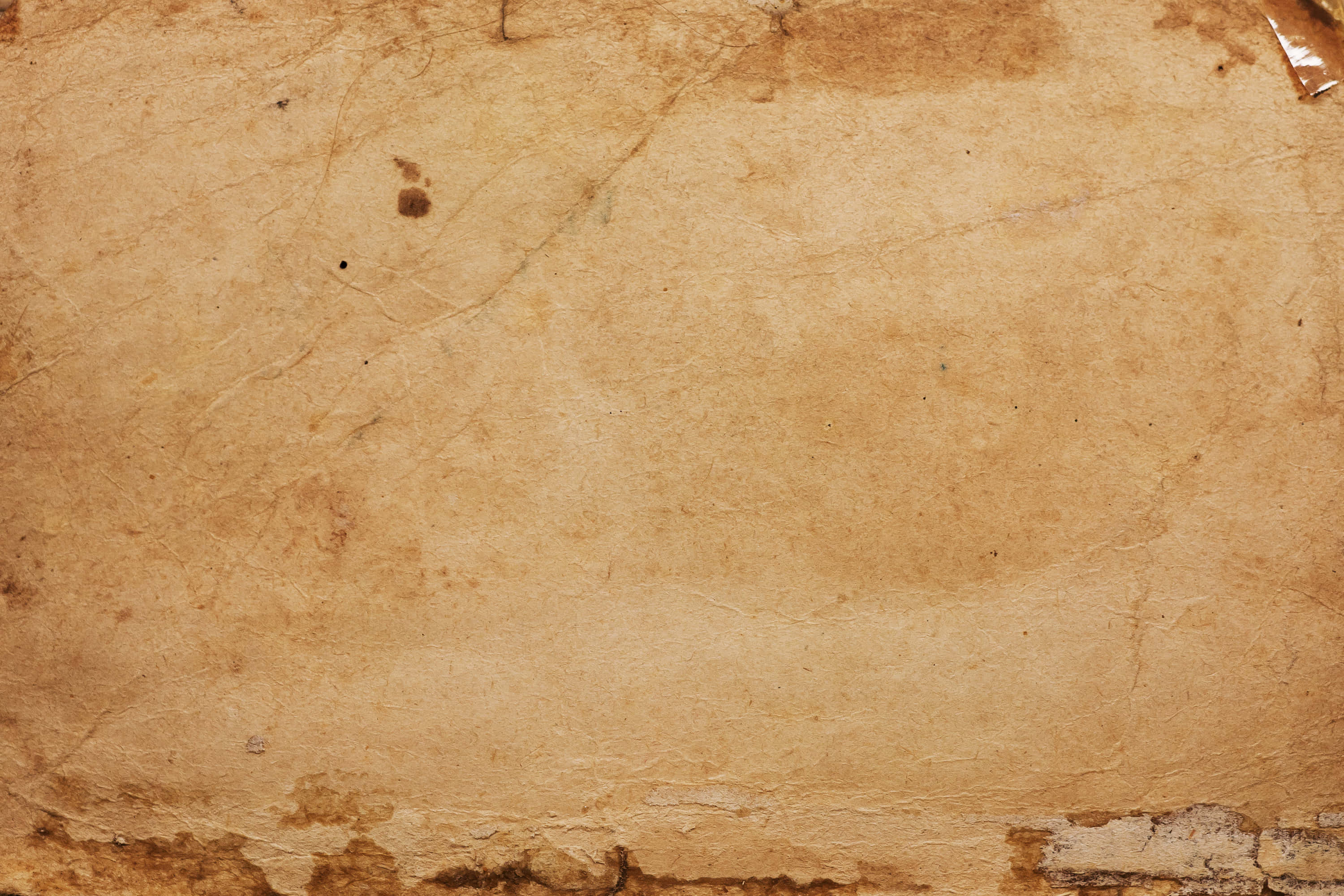 et gammelt stykke papir med en rift i Wallpapers