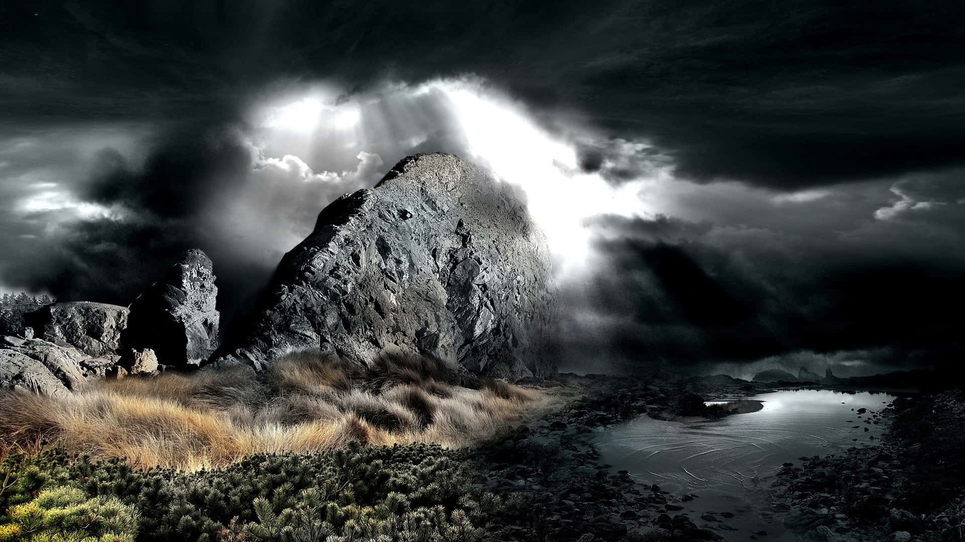 et mørkt landskab med en stormfuld himmel og klipper Wallpapers