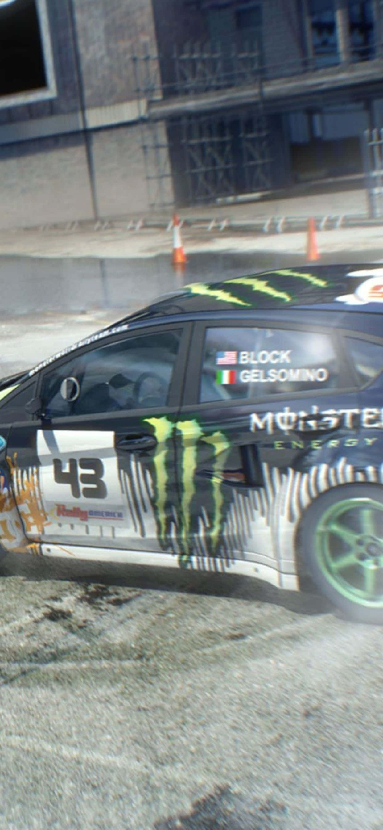 et monster truck kører ned ad en gade Wallpapers