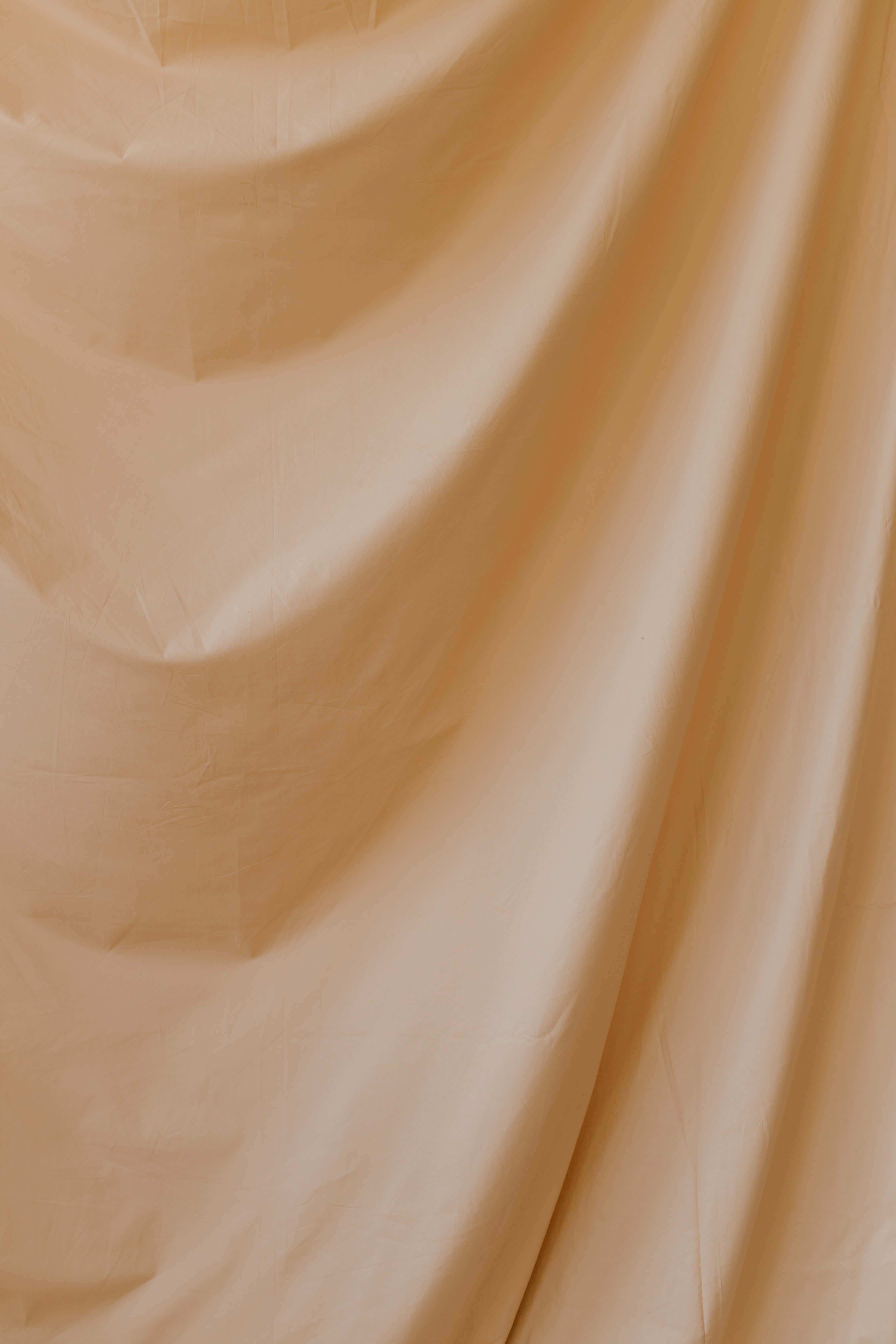 et nærbillede af et beige stof Wallpapers