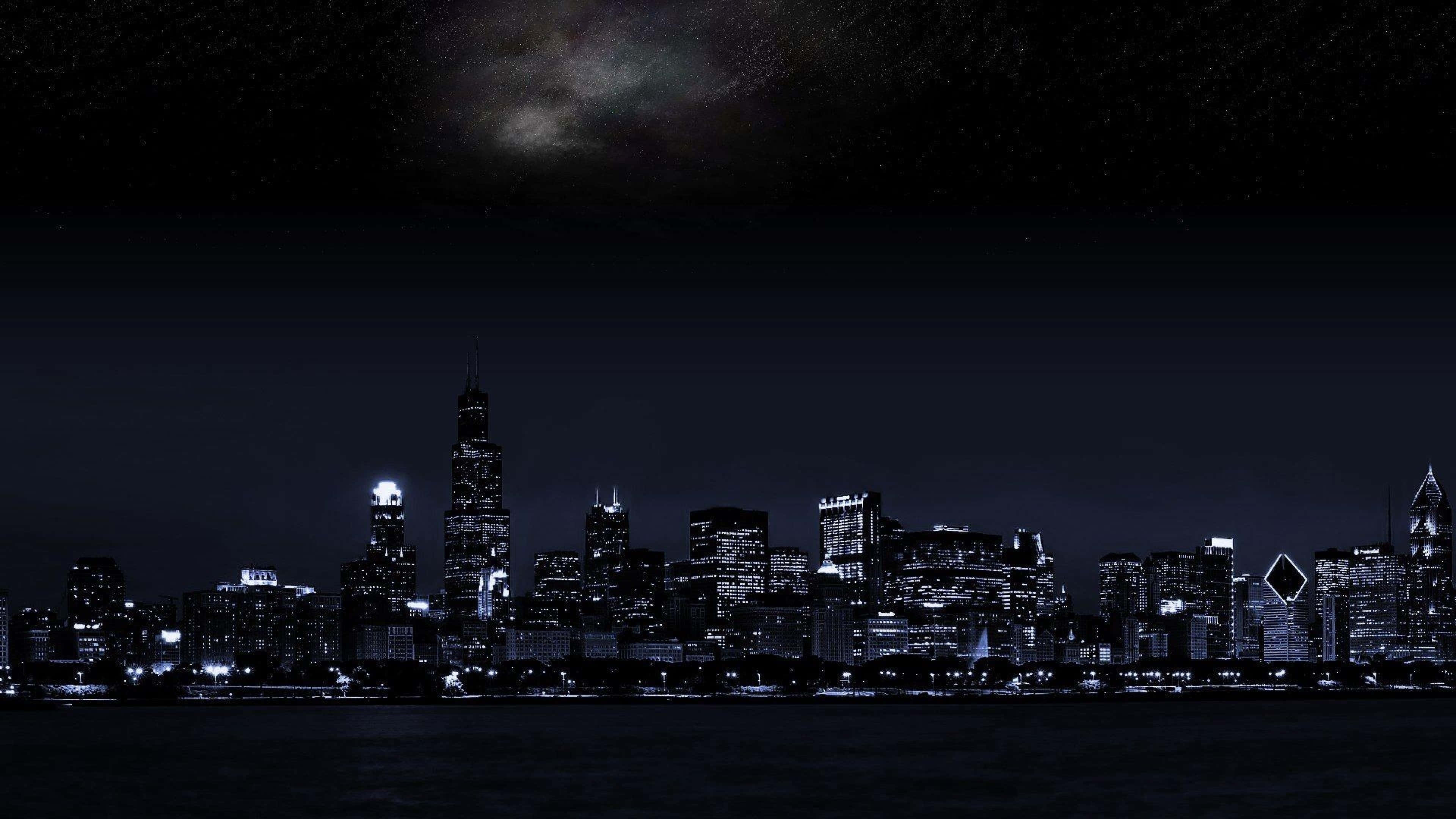 Fængslende natteudsigt over en mørk by Wallpapers