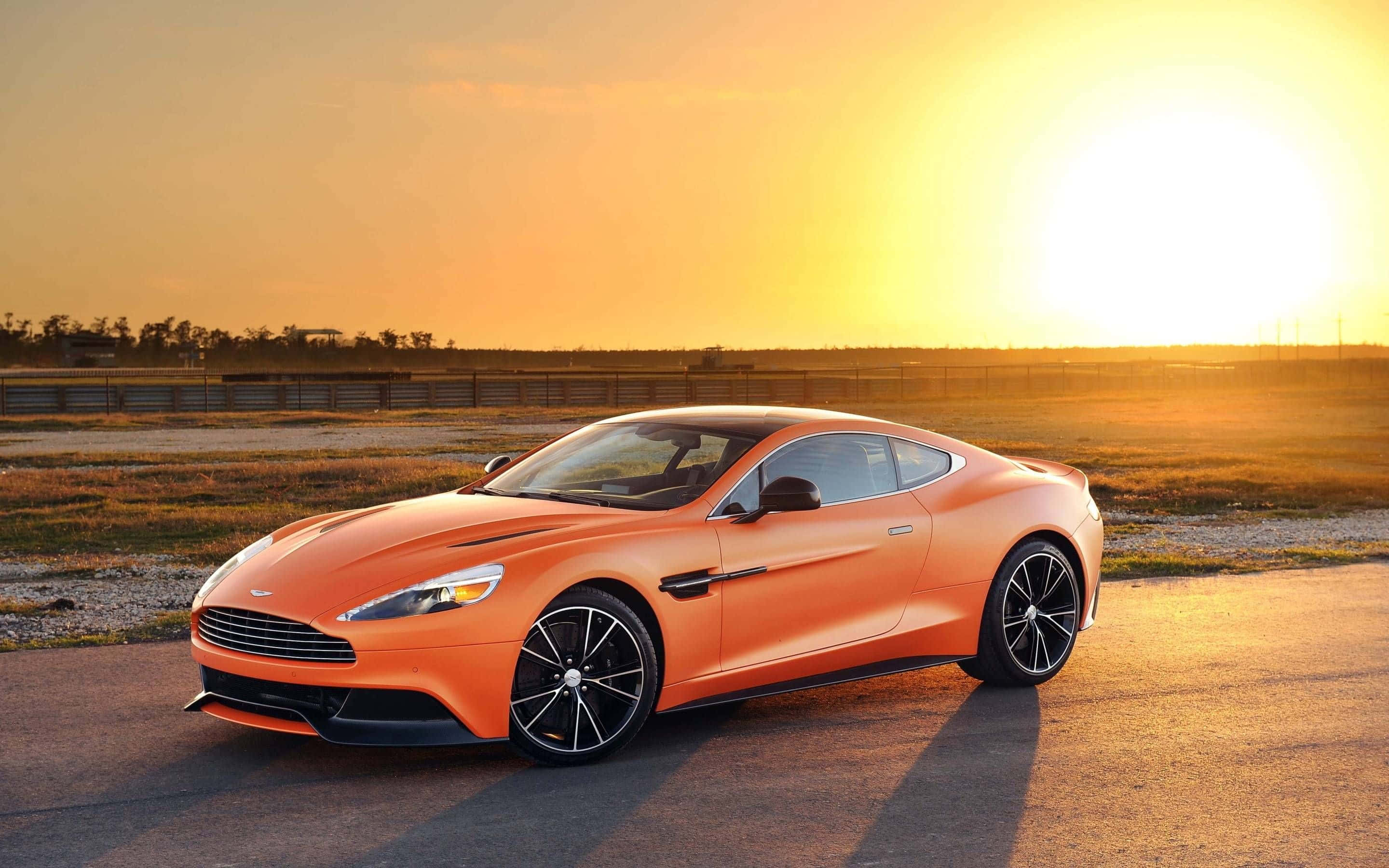 Fængslende Aston Martin Vanquish i bevægelse Wallpapers