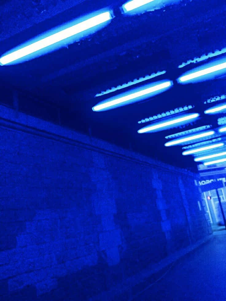 Gør din dag lysere med en farverig Neon Blå Aesthetic Wallpapers