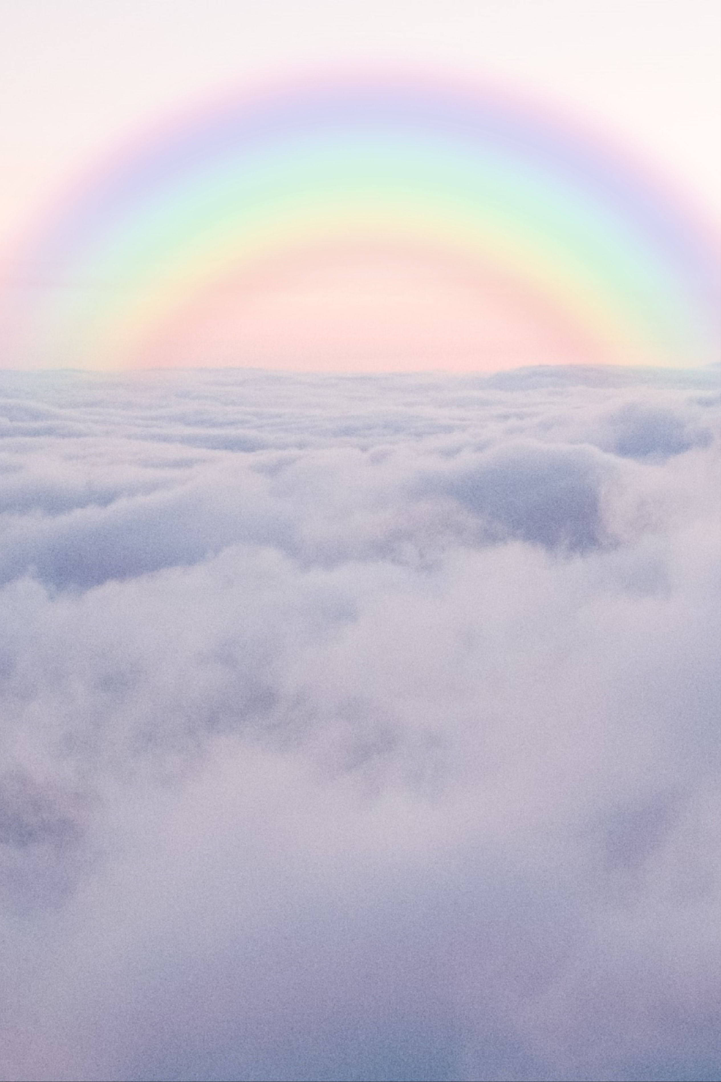 Hav af skyer med pastelregnbue Wallpapers