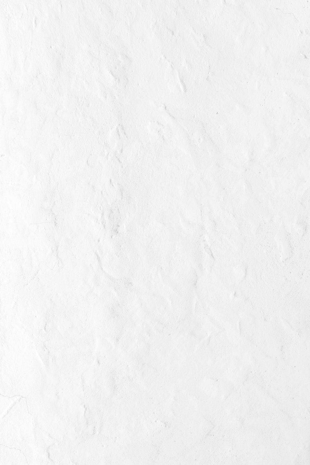 Hvid skærm med tekstureret væg som telefonbaggrund Wallpapers