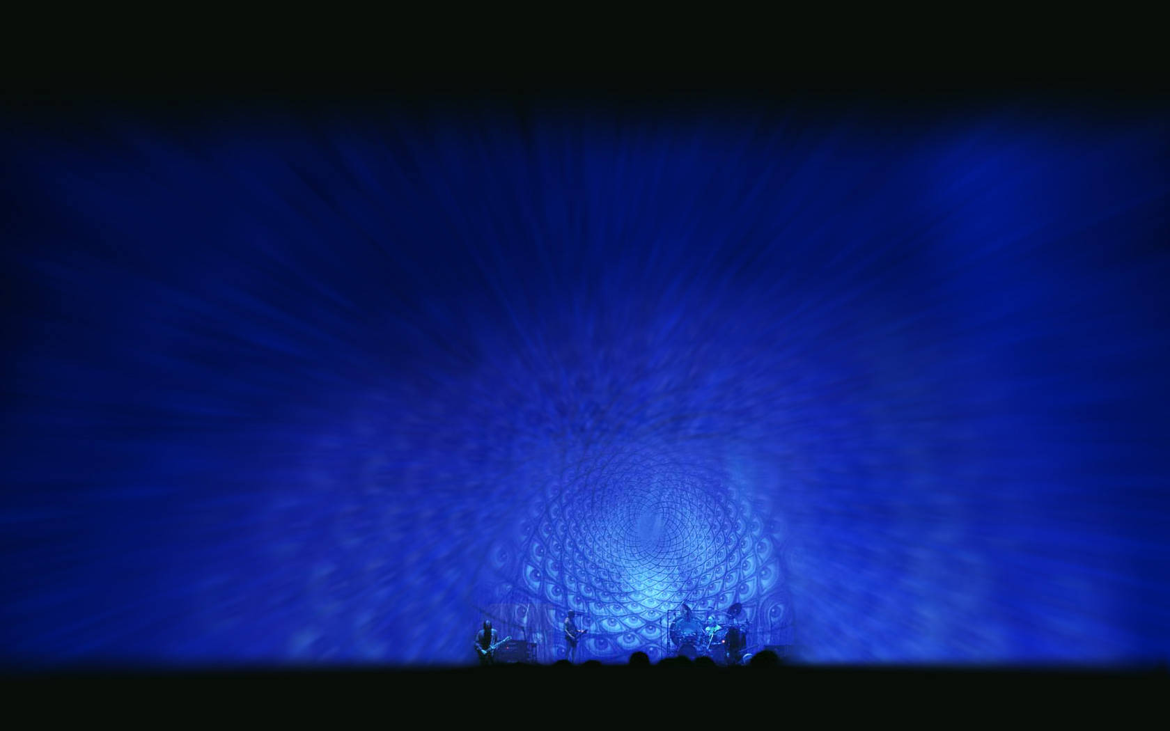 Iconic Rock Band Tool Against a Mesmerizing Blue Eye Pattern Wallpapers