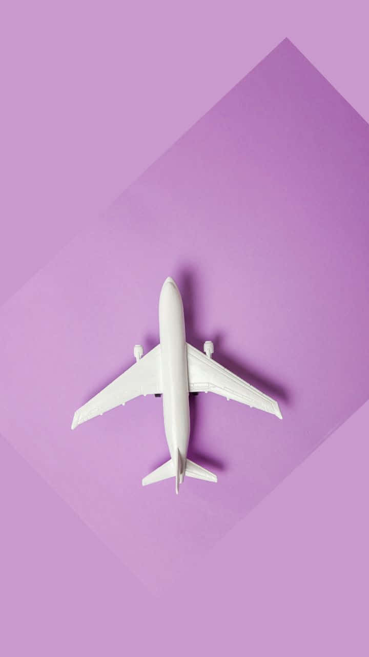 Lys lilla 720p rejsebaggrund med flymodel Wallpapers