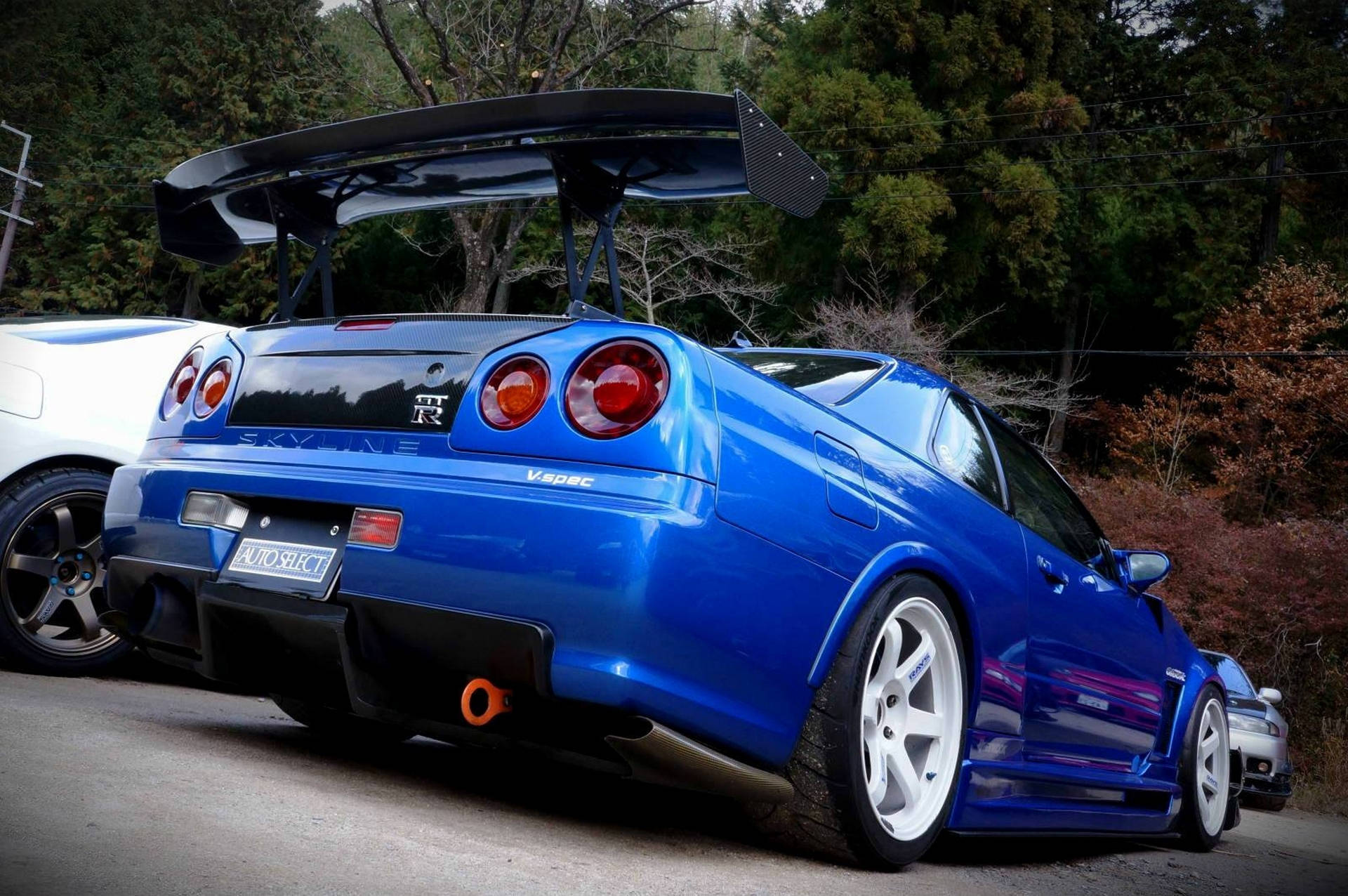 Majestætisk billede af en Nissan Skyline GTR R34 i højopløsning. Wallpapers