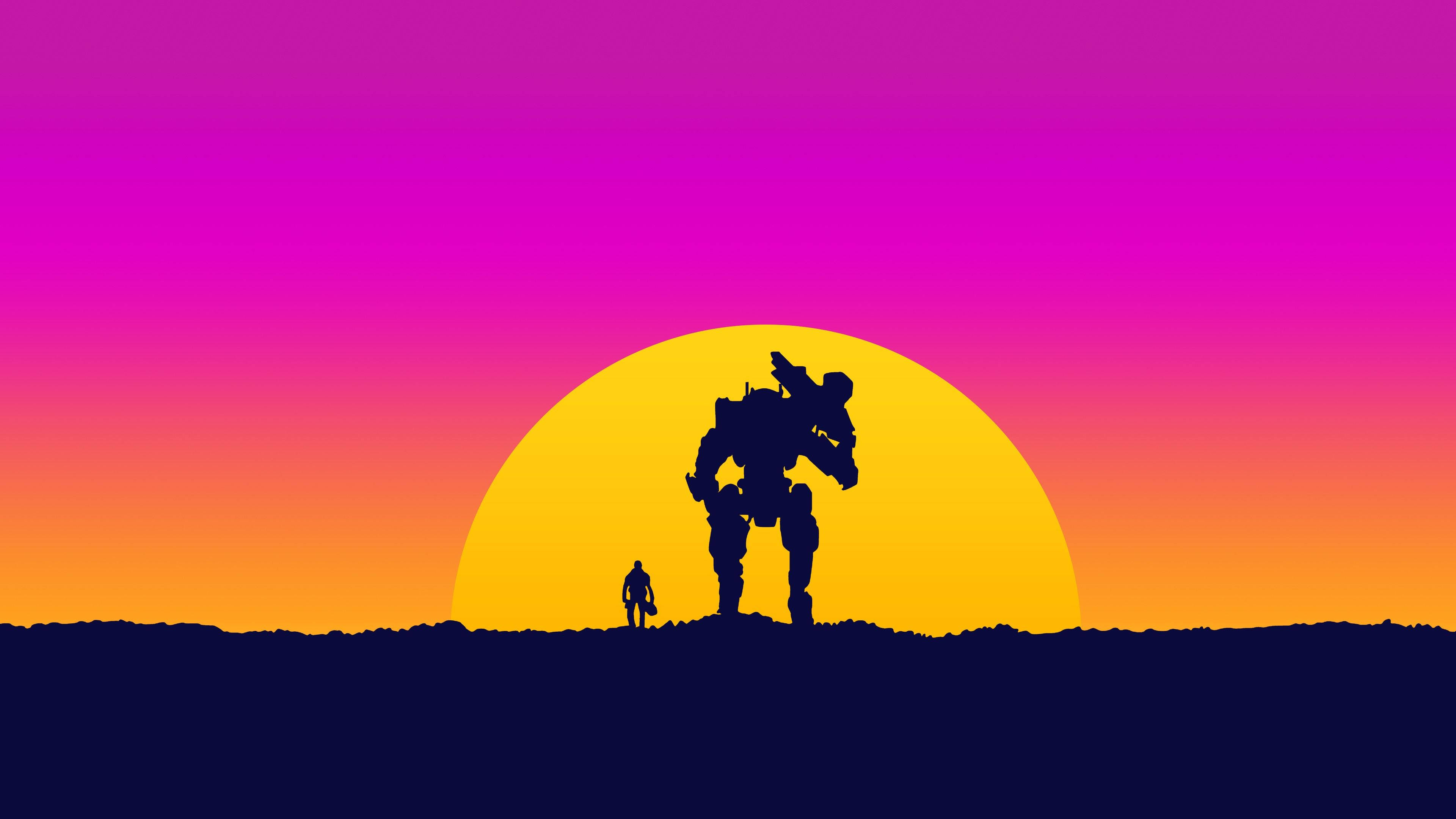 Mand og robot spiller spil ved solnedgang Wallpapers