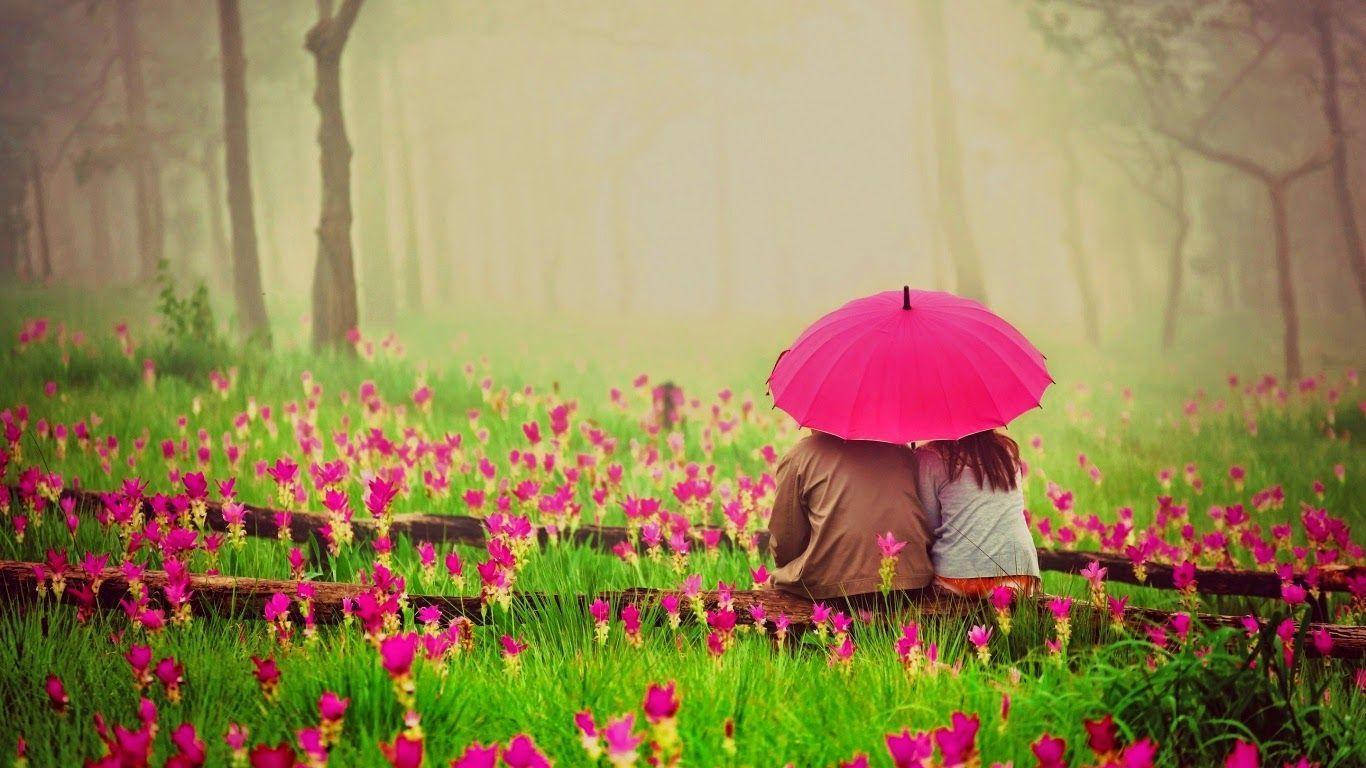 Min elskede sidder på jorden blandt blomster Wallpapers