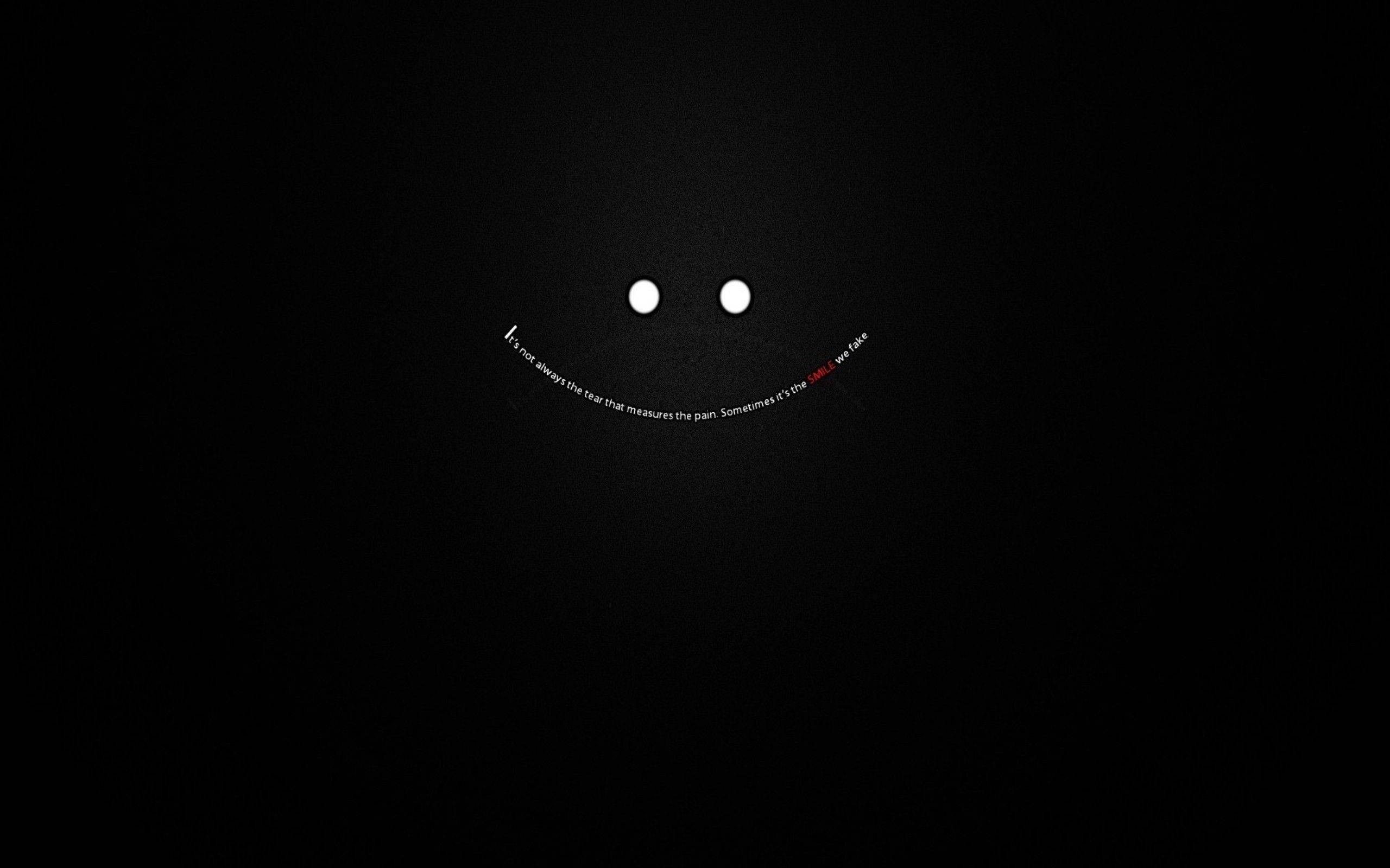 Mørk bærbar med smiley og citater Wallpapers
