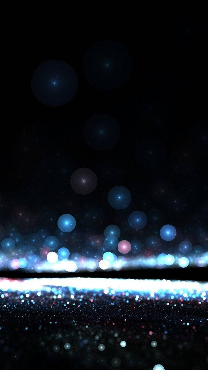 Mørk telefon med glødende blå kugler Wallpapers