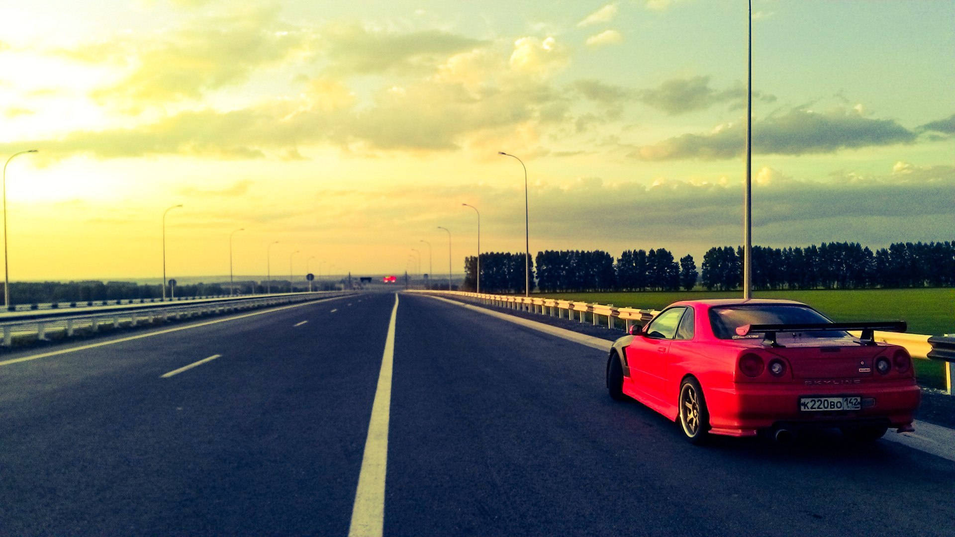 Nissan Skyline GTR R34 solnedgang på vejen Wallpapers