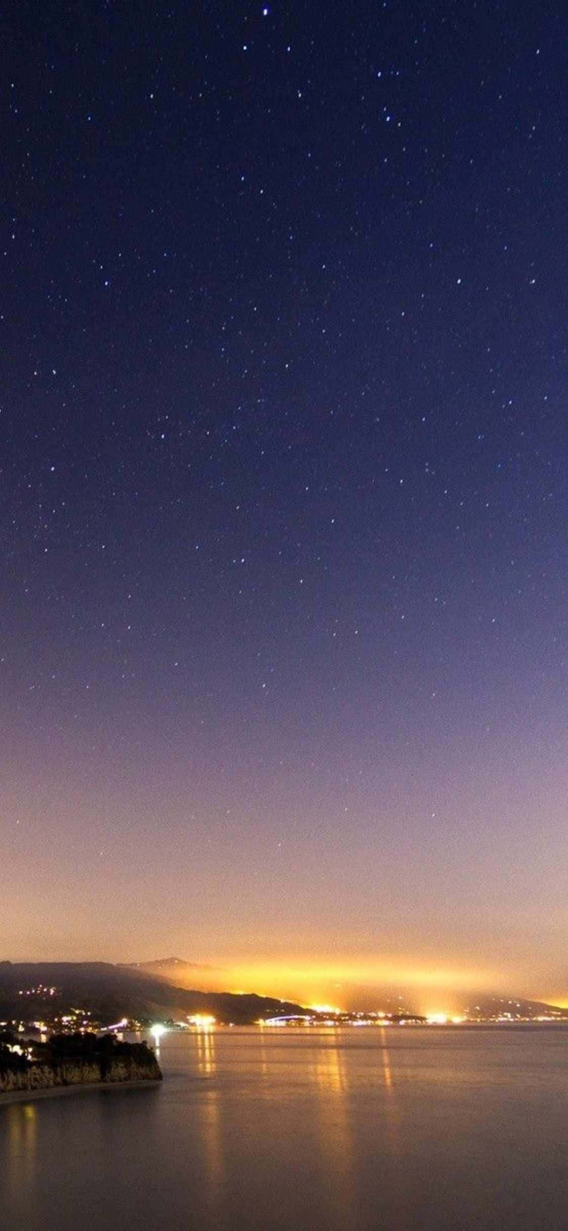 Nyd den fantastiske skønhed ved Malibu strand med den utrolige iPhone X Wallpapers