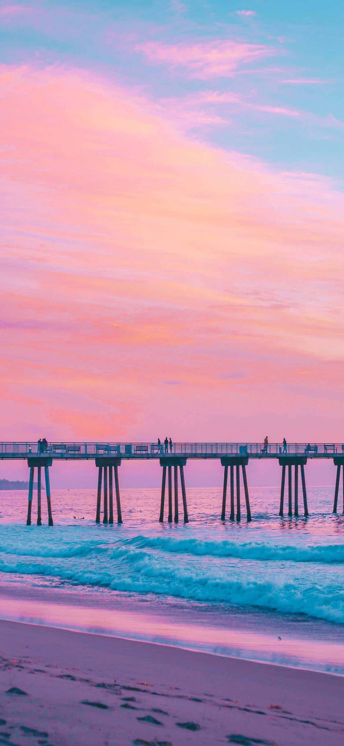 Nyd en betagende solnedgang over den californiske kyst med iPhone X Wallpapers
