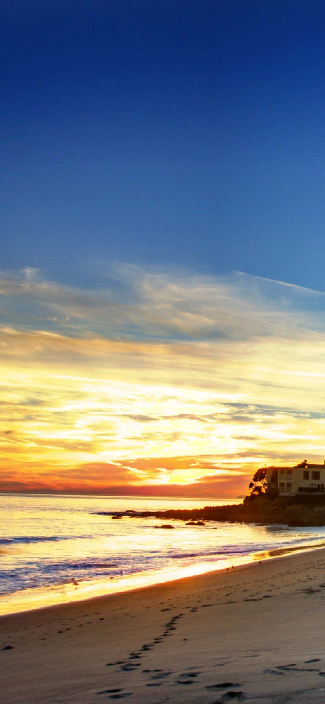 Oplev skønheden og kraften i iPhone Xs Malibu Wallpapers