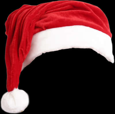 Rød julemandshat isoleret på sort baggrund Wallpapers