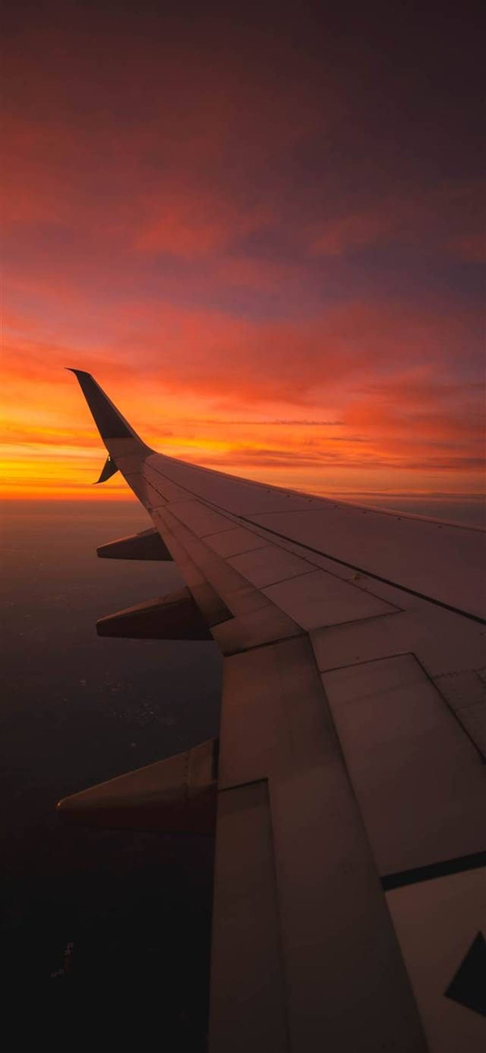 Solnedgang med flyvemaskinevinge Android Wallpapers