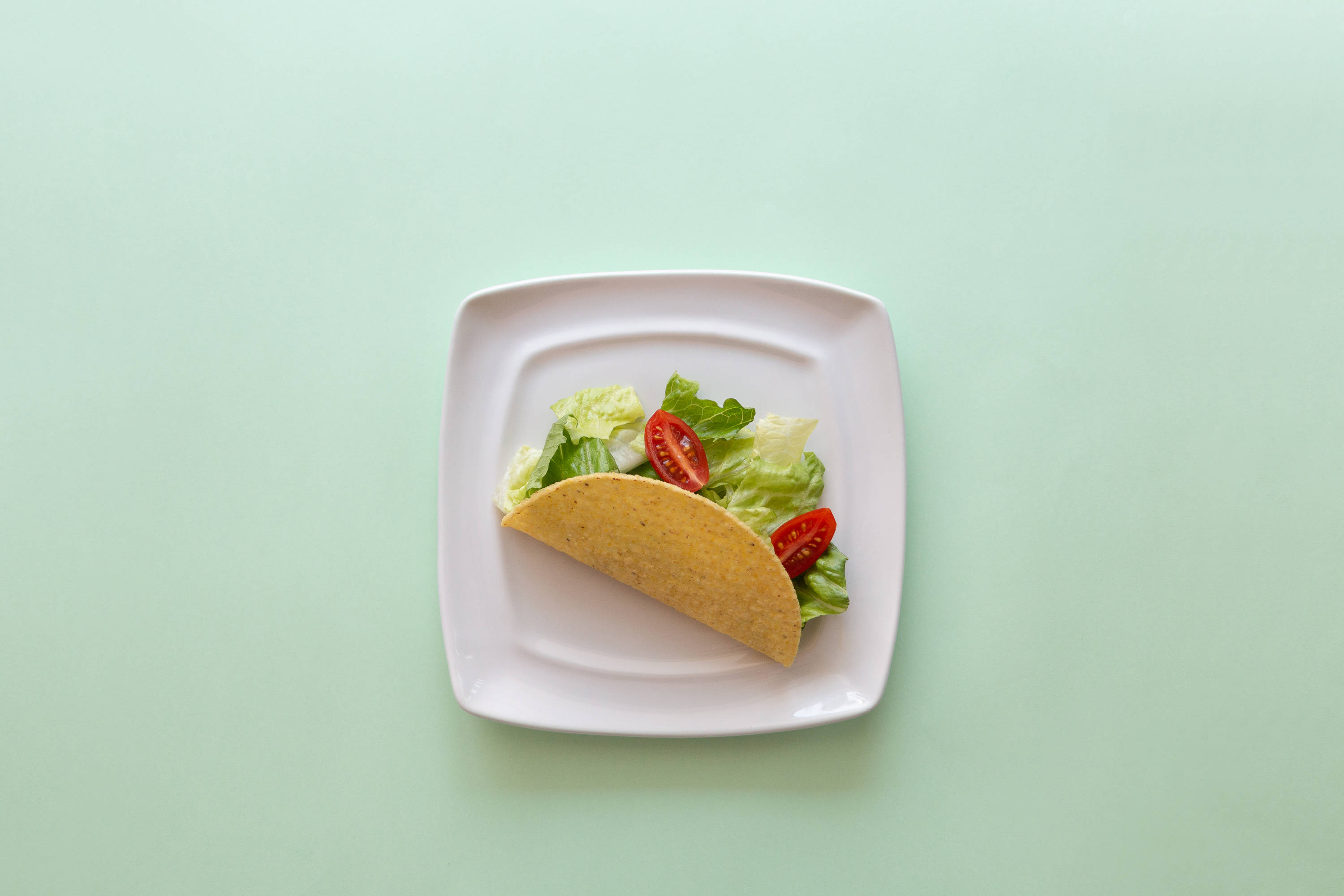 Taco på pastelgrønt bord Wallpapers
