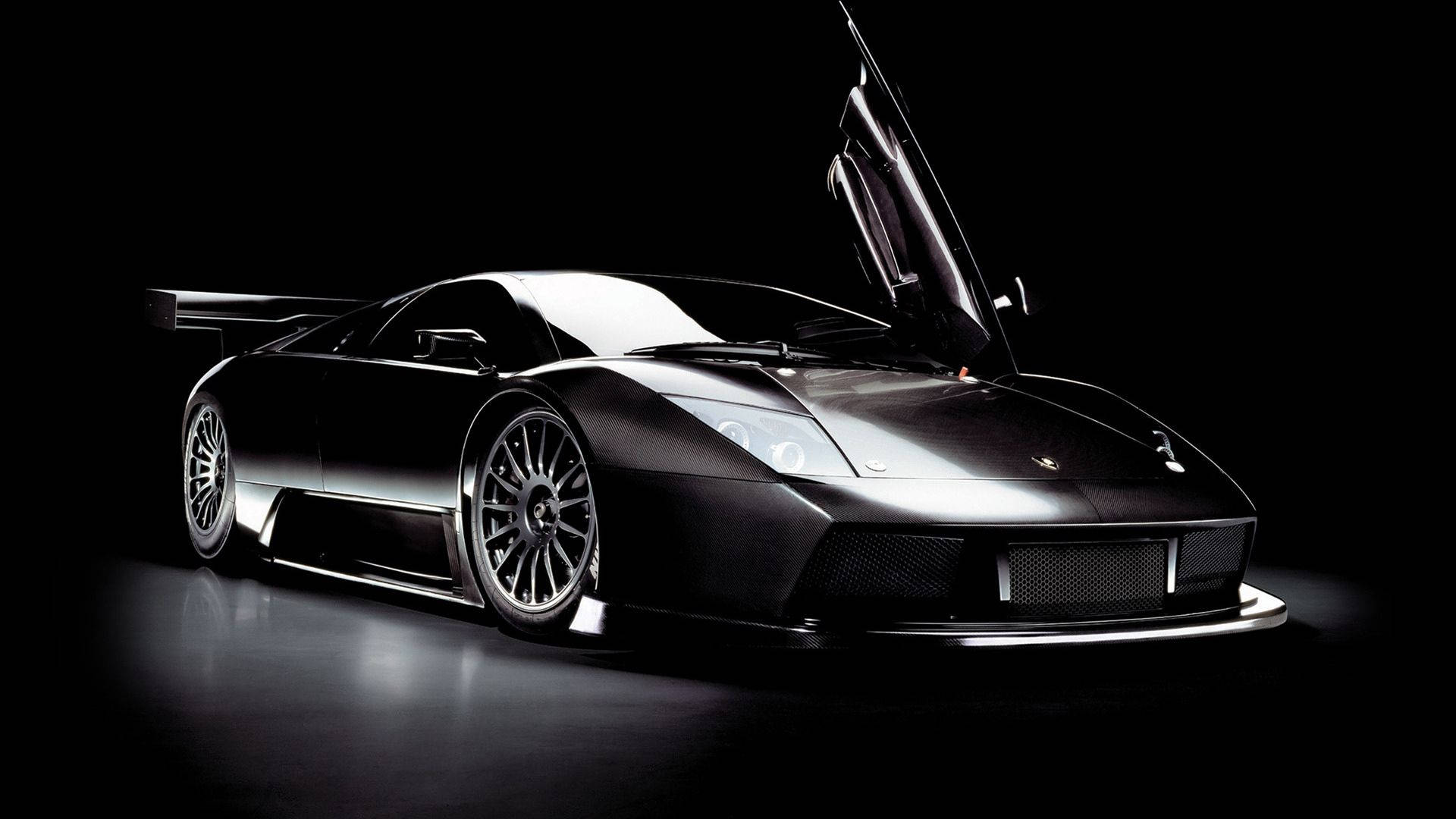 Fantastisk biltapet af sort Lamborghini med klappedøre. — Sort Wallpapers