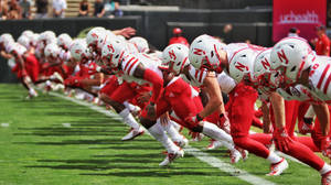 Amerikansk fodbold Nebraska Cornhuskers baggrund — Pro Display XDR Wallpapers