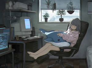 Anime-pige sover foran bærbar computer