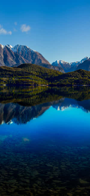 Betagende udsigt over en solnedgang over vandet — Motorola Wallpapers