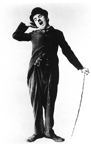 Charlie Chaplin med en meget søvnig mine, mens han holder sin stok tapet — Honor Pad 20 Pro Wallpapers