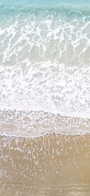 Fængslende iPhone X-baggrund, der fanger et betagende strandformat — Motorola Wallpapers