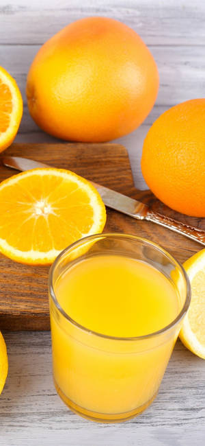 Appelsinjuice og skiver tapet — iPhone 15 Plus Wallpapers