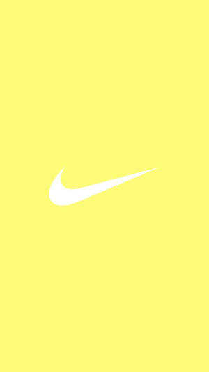 Fortryllende stænk af sød pastelgul æstetik med ikonisk Nike-logo — Pastelgul æstetik Wallpapers