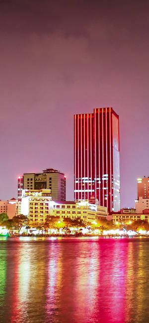 Ho Chi Minh city pink building wallpaper — iPhone 15 Wallpapers