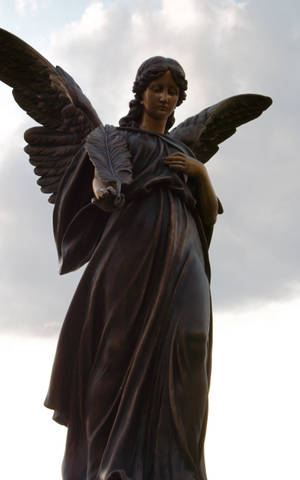 Katolsk bestilt engelstatue — Moto Pad 70 Wallpapers