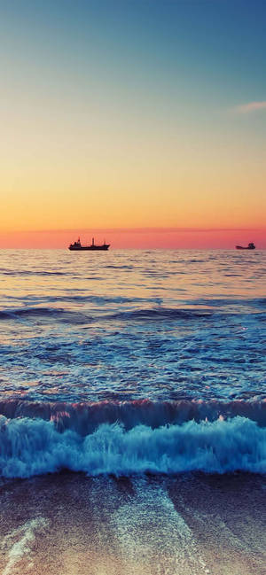Hav med brydende bølger ved solnedgang iPhone XR wallpaper — iPhone Xr Wallpapers